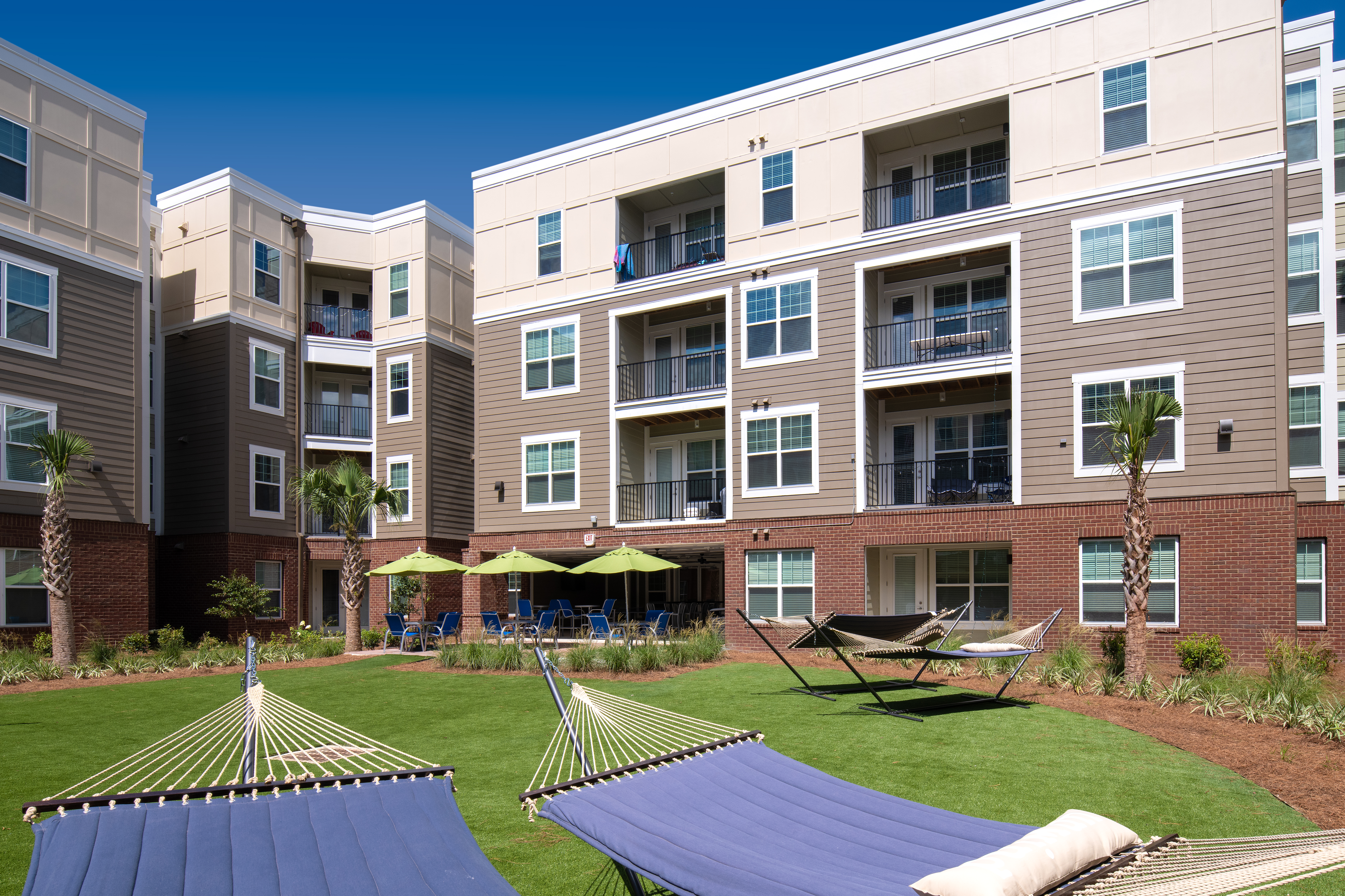 quantum on west call off campus apartments near fsu tallahassee florida courtyard hammocks and patio lounge spaces